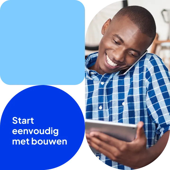 Man in een geruit overhemd met telefoon en tablet.